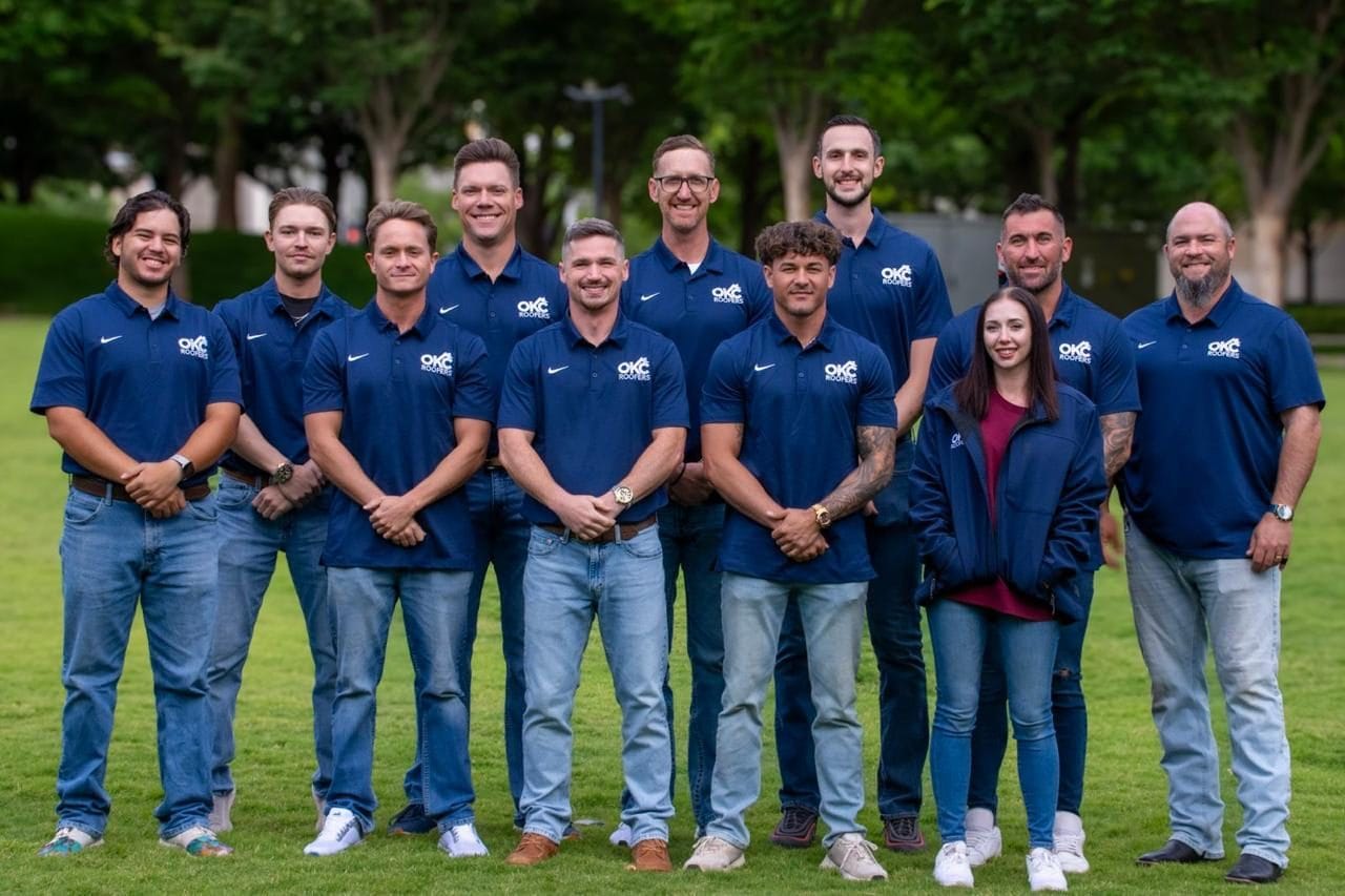 OKC Roofers full company team photo of ten staff members in branded polos in Oklahoma City